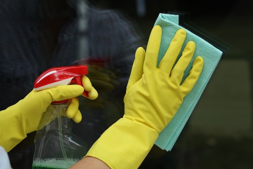 Professional home cleaners in Harringay working in a modern living room