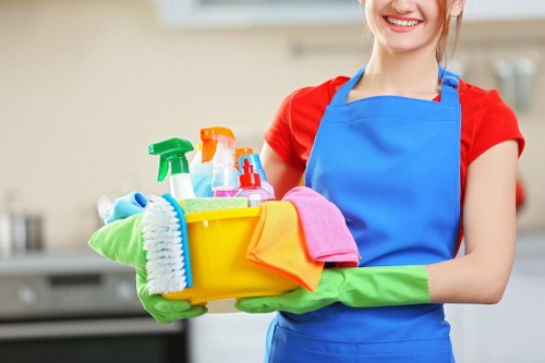Cleaning professional using PPE during a property clean